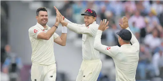  ?? Photo: Zimbio ?? England bowler James Anderson (left) celebrates with Joe Root and Jos Buttler after dismissing India batsman Lokesh Rahul during day two of the 2nd Specsavers Test Match at Lord’s Cricket Ground on August 10, 2018 in London, England.