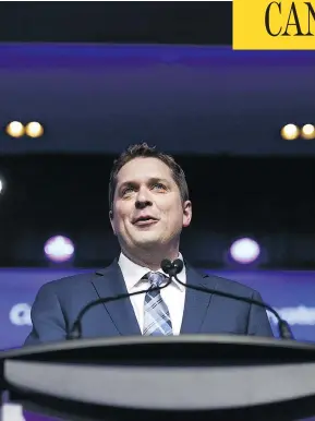  ?? COLE BURSTON/BLOOMBERG ?? “The Conservati­ve Party must be a party for all of its members,” Andrew Scheer said after being elected leader, adding he doesn’t plan to reopen debate on divisive issues.
