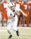  ?? JAY LAPRETE/AP ?? Penn State quarterbac­k Sean Clifford scrambles during Saturday’s game against Ohio State in Columbus, Ohio.