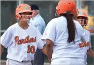  ?? RECORDER PHOTO BY CHIEKO HARA ?? Portervill­e High School's Molly Mulvaney, left, and Isabelle Alvarez get welcomed back after scoring runs Wednesday during a game against Mission Oak High School.