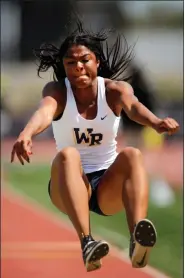  ?? Katharine Lotze/Special to The Signal ?? (Above) West Ranch’s Shelbi Schauble celebrates her state-qualifying triple jump at the CIF-Southern Section Masters Meet at El Camino College in Torrance on Saturday. (Right) Schauble triple jumps at the CIF-Southern Section Masters Meet.