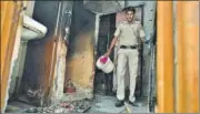  ?? SANCHIT KHANNA/HT PHOTO ?? A police personnel inside the house of an elderly couple, who were charred to death after a fire broke out in their house at Sudershan Park near Moti Nagar.