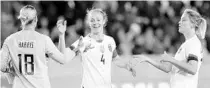  ?? MICHAEL WYKE/AP ?? U.S. goalkeeper Ashlyn Harris (18), defender Becky Sauerbrunn (4) and defender Abby Dahlkemper celebrate the 8-0 win over Panama Friday.