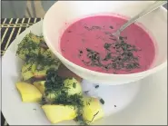  ??  ?? The cold beet soup called Saltibarsc­iai in Lithuanian is a pink crimson color and is typically served with a side of hot potatoes sprinkled with dill and chives.