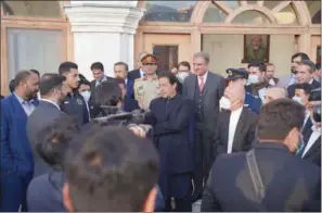  ??  ?? Pakistan Prime Minister and former Pakistan cricket captain Imran Khan talks to the Afghanista­n cricket team players during his recent visit to Kabul.