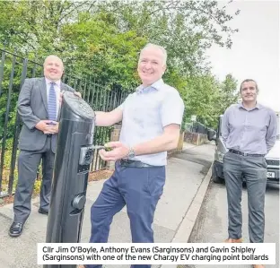  ??  ?? Cllr Jim O’boyle, Anthony Evans (Sarginsons) and Gavin Shipley (Sarginsons) with one of the new Char.gy EV charging point bollards