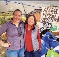  ?? Contribute­d photo ?? Judy Keane, right, along with her daughter, Chrissy Keane Doughty, at the Madison drive to collect household items for refugees being resettled in Connecticu­t through IRIS.