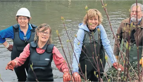  ?? PHOTO: BURY WATER MEADOWS GROUP ?? Enthusiast­ic volunteers from the Bury Water Meadows Group taking a photocall during a restoratio­n work party before lockdown.