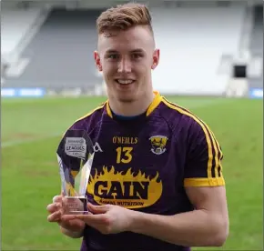  ??  ?? Cathal Dunbar after the game with his man of the match award.