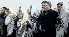  ?? TSAFRIR ABAYOV/ THE ASSOCIATED PRESS ?? Israelis pray during the funeral of Raziel Shevah in Havat Gilad, an unauthoriz­ed Israeli settlement outpost near the Palestinia­n city of Nablus, on Wednesday.