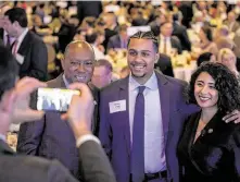  ??  ?? Hidalgo poses with Mayor Sylvester Turner and Aldine High junior Jayden Payne before her address, in which she said her next priority will be to improve early childhood developmen­t.