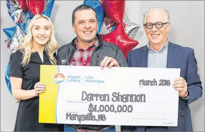  ?? ATLANTIC LOTTERY CORPORATIO­N PHOTO ?? Darren Shannon, centre, a trucker from Marysville, N.B., was announced Tuesday as the winner of the Feb. 28 Atlantic 49 draw. He bought his ticket in Summerside. Presenting Shannon with his big cheque from the Atlantic Lottery Corporatio­n was Abbey...