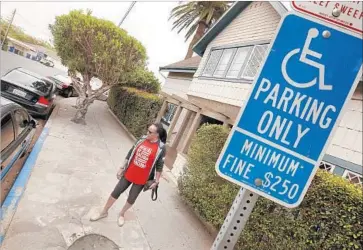  ?? Al Seib Los Angeles Times ?? DEL HUNTER-WHITE of Venice has had trouble getting a blue painted curb for disabled parking. In 2012, changes in state and federal guidelines made it far more complicate­d and costly to add such parking spots.