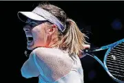  ?? [AP PHOTO] ?? Russia’s Maria Sharapova follows through on a return shot to Latvia’s Anastasija Sevastova during their second round match at the Australian Open tennis championsh­ips in Melbourne, Australia, on Thursday.