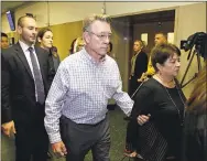  ?? ERIC RISBERG THE ASSOCIATED PRESS THE ASSOCIATED PRESS ?? Left: Jim Steinle, center, and Liz Sullivan, right, the parents of Kate Steinle, walk to a courtroom for closing arguments in the trial of Jose Ines Garcia Zarate, accused of killing their daughter, on Monday in San Francisco. Below: Flowers and a...