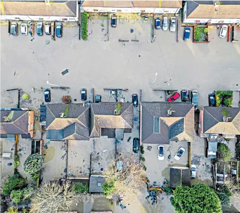  ?? ?? Houses in Loughborou­gh, Leicesters­hire were flooded yesterday after the Grand Union Canal burst its banks following Storm Henk