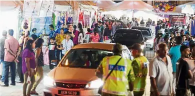  ??  ?? Jamming the streets: Shoppers crowding Little India in Ipoh for Indian sweets, clothing and prayer items.