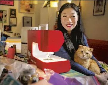  ?? Jason Armond Los Angeles Times ?? KRISTINA WONG, here in her L.A. home, founded the Facebook group the Auntie Sewing Squad, which sews COVID-19 masks. It just celebrated its first anniversar­y — with more than 800 volunteers nationwide.