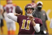  ?? ANDREW HARNIK — THE ASSOCIATED PRESS, FILE ?? Washington Football Team quarterbac­k Alex Smith (11) throws the ball before the start of a Nov. 22 game against the Bengals in Landover, Md.