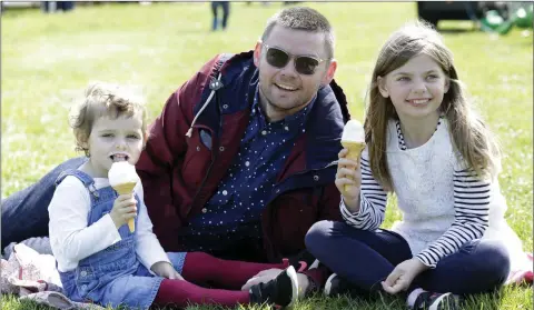  ??  ?? Nola, Paul and Róisín O’Connor enjoying some ice cream at the Tidy Towns Fun Day in Burnaby Park, Greystones.