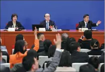  ?? ZOU HONG / CHINA DAILY ?? Liu Jieyi (center), spokesman for the second session of the 14th Chinese People’s Political Consultati­ve Conference National Committee, addresses a news conference in Beijing on Sunday. Liu briefed the media about the session and answered questions.