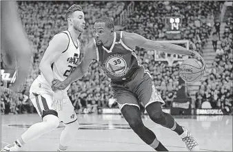  ?? [RICK BOWMER/THE ASSOCIATED PRESS] ?? Utah Jazz forward Gordon Hayward guards Golden State Warriors forward Kevin Durant in the first half Saturday in Salt Lake City.