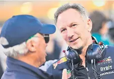  ?? — AFP photo ?? Horner (right) speaks while waiting for the start of the Bahrain Formula One Grand Prix at the Bahrain Internatio­nal Circuit in Sakhir.