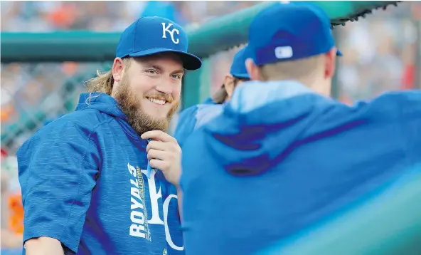  ?? — THE ASSOCIATED PRESS ?? Kansas City Royals relief pitcher Brandon Maurer watches from the dugout during their game in Detroit against the Tigers on Tuesday night. Maurer, a former Mariners starter, had just arrived after a trade with the San Diego Padres.