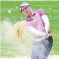  ??  ?? PUTTING PROBLEMS: Brooke Henderson hits out of a bunker on the fourth hole.