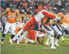  ?? John Leyba, The Denver Post ?? Broncos quarterbac­k Paxton Lynch gets sacked by Kansas City Chiefs linebacker Tanoh Kpassagnon during the third quarter Sunday.