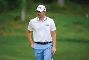  ?? The Associated Press ?? ■ Patrick Cantlay reacts while approachin­g the eighth green during the final round of the BMW Championsh­ip golf tournament Sunday at Caves Valley Golf Club in Owings Mills, Md.