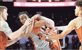  ?? / Athens Banner-Herald-Joshua L. Jones ?? Georgia forward Nicolas Claxton (33) competes with Texas forward Dylan Osetkowski (21), guard Kerwin Roach II (12) and forward Jaxson Hayes (10) to keep possession of the ball during Saturday’s game in Athens.