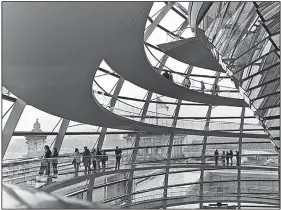  ?? Rick Steves’ Europe/DOMINIC ARIZONA BONUCCELLI ?? At the Reichstag in Berlin, visitors are treated to endless vistas as they spiral up the 80-foot-high glass dome.