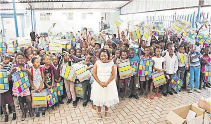  ?? Picture: Fourways Review ?? LITTLE MISS SUNSHINE. Lihle Zilwa, front, with some pupils from Philena School.