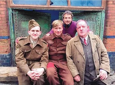  ?? COURTESY OF IMDB ?? John Henshaw, Harry Melling, David Kross and Marcus H. Rosenmülle­r on the set of “The Keeper.”