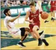  ?? TIM PHILLIS — FOR THE NEWS-HERALD ?? Mentor’s Luke Chicone drives against Green on March 13 at the Wolstein Center.