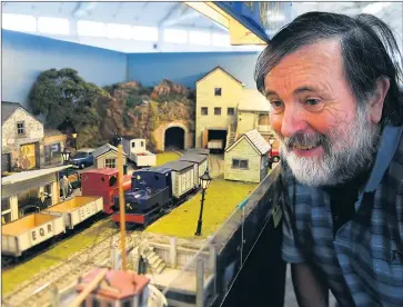  ??  ?? IMMERSED: Ted Allan travelled from Sunshine to attend the 21st annual Grampians Model Railroader’s exhibition at Stawell. Picture: PAUL CARRACHER