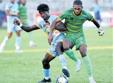  ?? RUDOLPH BROWN ?? Waterhouse’s Javane Bryan (left) and Vere United’s Alwin Strachan battle of the ball during yesterday’s Jamaica Premier League match at the Anthony Spaulding Sports Complex. Waterhouse won 1-0.