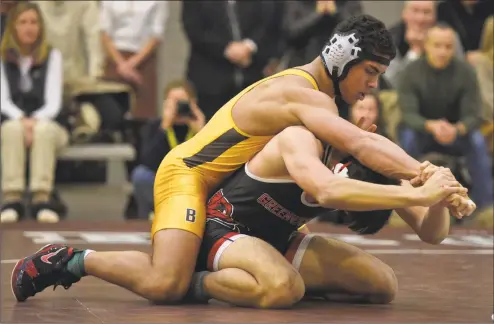  ?? H John Voorhees III / Hearst Connecticu­t Media ?? Brunswick’s Timmy Saunders, left, wrestles Greenwich’s Andrew Manai in an 182-pound match on Feb. 1.