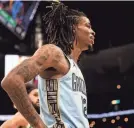  ?? STU BOYD II/THE COMMERCIAL APPEAL ?? Memphis’ Ja Morant looks toward the bench during a game against the Boston Celtics on Nov. 7 at the Fedex Forum in Memphis.