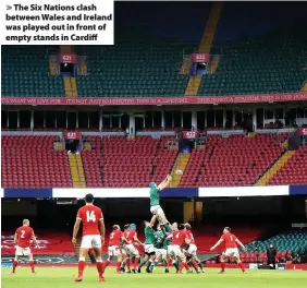  ??  ?? > The Six Nations clash between Wales and Ireland was played out in front of empty stands in Cardiff