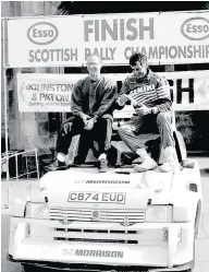  ??  ?? TRIUMPH Donald and co-driver Bob Wilson after a race win in his championsh­ip year of 1991. Picture: John Fife