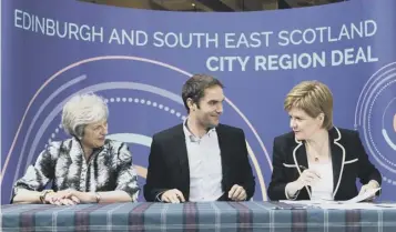  ?? PICTURE: JANE BARLOW ?? 0 Theresa May, Adam Mcvey and Nicola Sturgeon sign the £1.3bn city deal