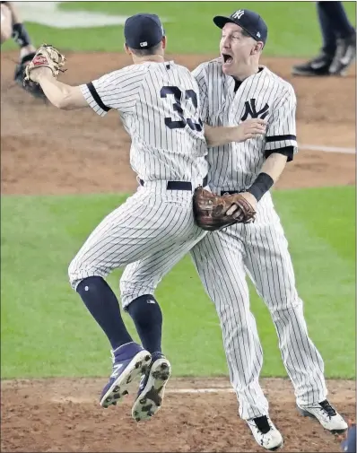  ?? [FRANK FRANKLIN II/THE ASSOCIATED PRESS] ?? Greg Bird, left, and Todd Frazier celebrate after the Yankees’ Game 5 victory.