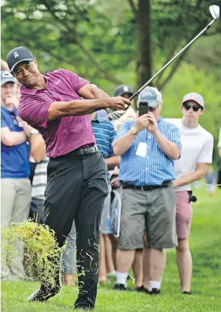  ?? DAVID DERMER/THE ASSOCIATED PRESS ?? With several injuries interrupti­ng his golf career, Tiger Woods has gone 10 years since winning a major.