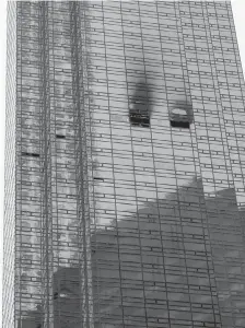  ??  ?? Fire damage is seen on a side of Trump Tower in New York on Saturday. The deadly blaze broke out on the 50th floor shortly before 6 p.m. The cause was not known.