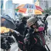  ?? PHOTO: GETTY IMAGES ?? A prodemocra­cy protester throws a molotov cocktail outside the Central Government complex on Sunday in Hong Kong.