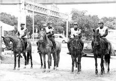  ??  ?? PDRM’s calvary unit monitoring the temple site yesterday. - Bernama photo