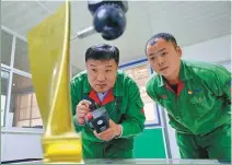  ?? PHOTOS BY YANG SHIYAO / XINHUA ?? From left: Veteran Shu Chunyan and his wife Li Peiyuan harvest chrysanthe­mums in Jiande, Zhejiang province. Shu invested 1 million yuan ($147,608) in the local chrysanthe­mum industry in 2015. TAN JIN / XINHUA Veteran Han Hongsheng (center) and technician­s check equipment at his mechanical and electrical maintenanc­e company in Qianxi, Hebei province. Han (left) tests the blade of a steam turbine in his company’s workshop.