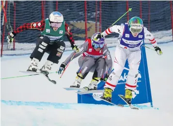  ?? — CP PHOTO ?? From left, Canada’s Georgia Simmerling, France’s Marielle Berger Sabbatel and Austria’s Andrea Limbacher compete in women’s semifinal at the World Cup ski cross event at Nakiska Ski resort in Kananaskis, Alta., on Saturday.